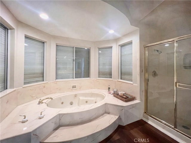 bathroom with separate shower and tub and hardwood / wood-style floors