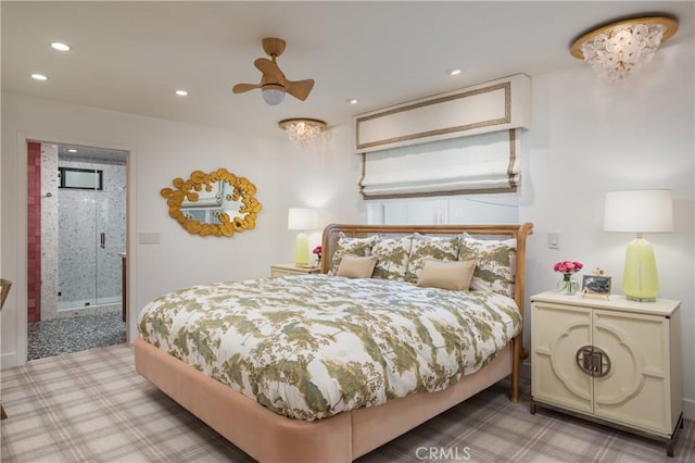 bedroom featuring ceiling fan and ensuite bathroom