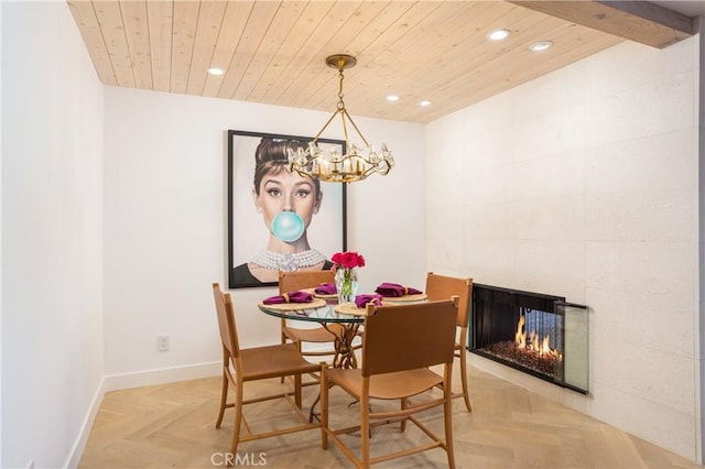 dining space featuring an inviting chandelier, wood ceiling, a fireplace, and light parquet flooring