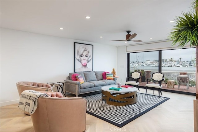 living room featuring ceiling fan and light parquet flooring