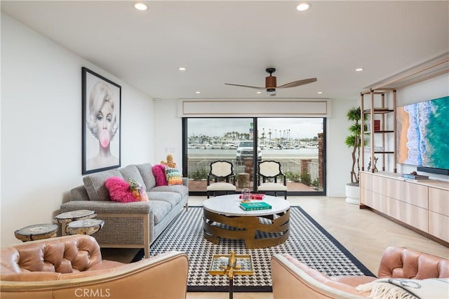 living room featuring ceiling fan and light parquet flooring