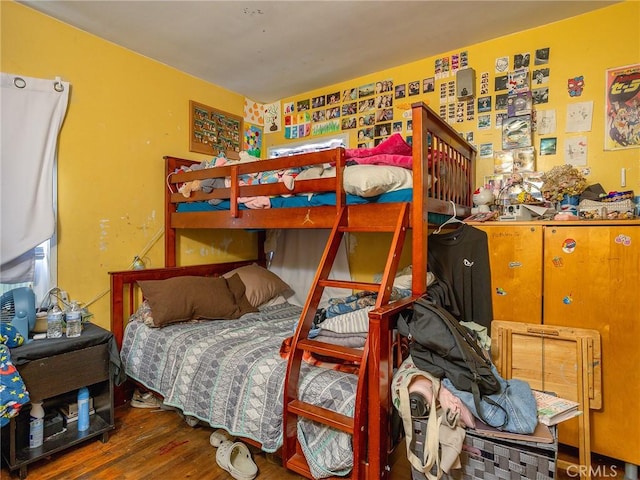 bedroom with hardwood / wood-style flooring