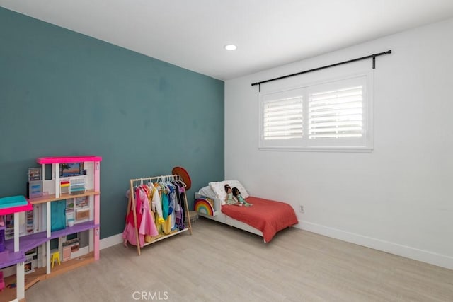 bedroom with light hardwood / wood-style flooring