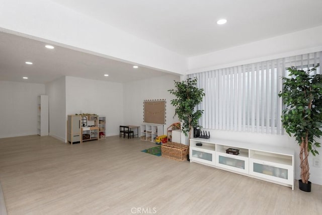 sitting room with light hardwood / wood-style flooring