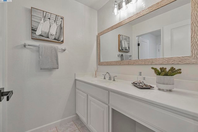 bathroom with tile patterned floors and vanity