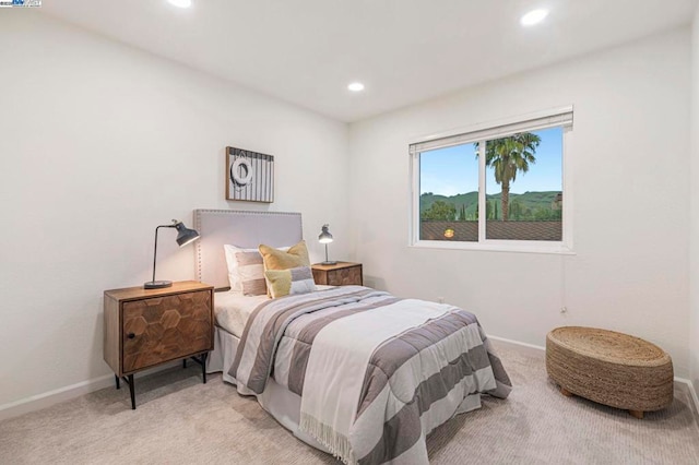 bedroom featuring light carpet