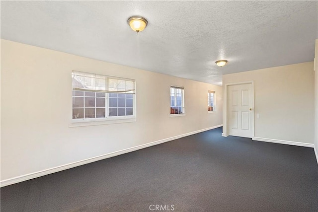 empty room featuring a textured ceiling