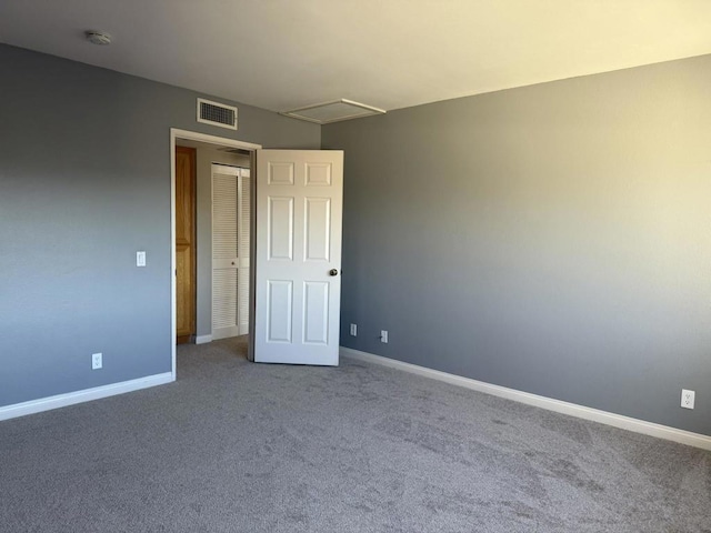 spare room featuring carpet