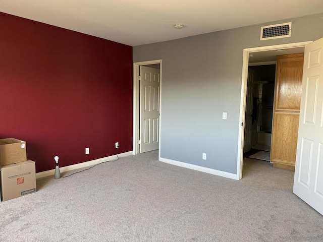 empty room with light colored carpet