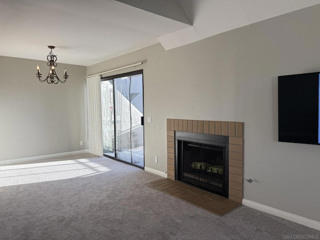 unfurnished living room with carpet floors, a brick fireplace, a chandelier, and lofted ceiling