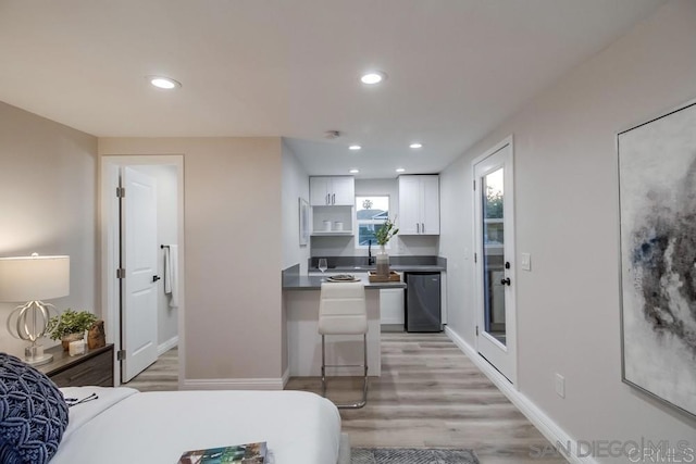 bedroom with light hardwood / wood-style flooring