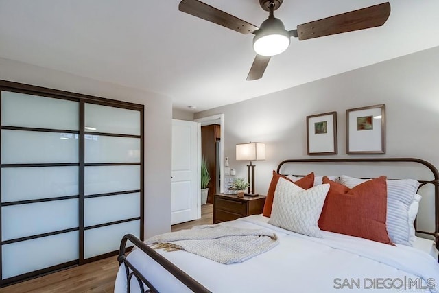 bedroom featuring ceiling fan and hardwood / wood-style flooring