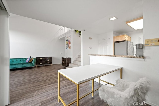 dining space featuring dark wood-type flooring