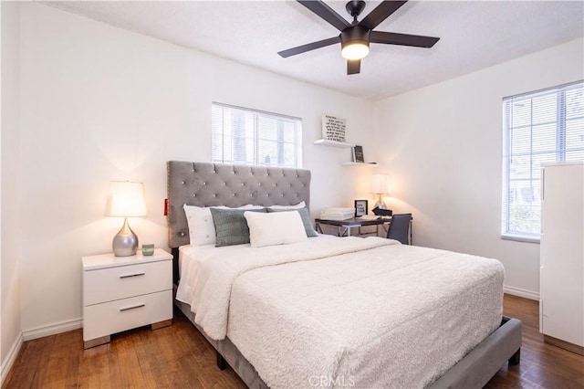 bedroom featuring ceiling fan and dark wood-type flooring