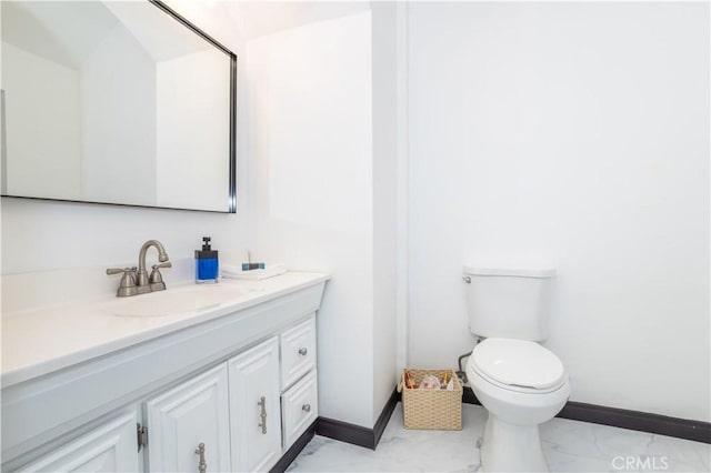 bathroom with toilet and vanity