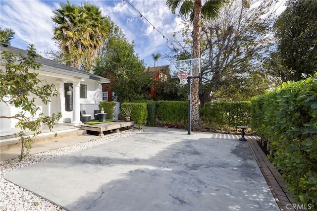 view of patio / terrace with basketball hoop