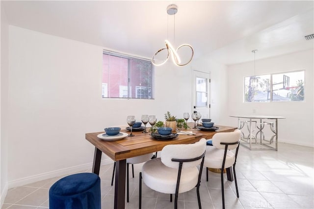 dining space with light tile patterned floors