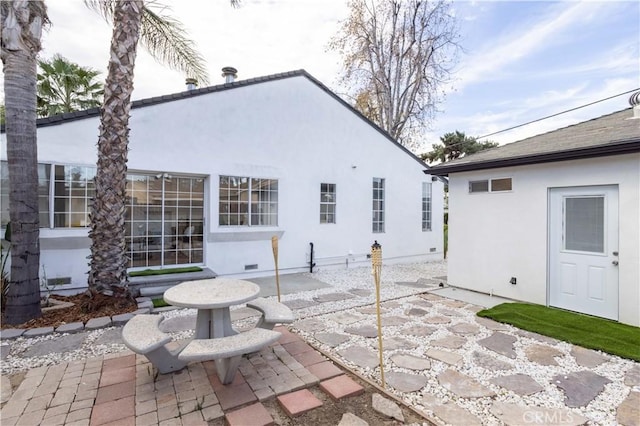 rear view of house featuring a patio area