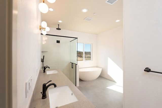 bathroom with vanity and independent shower and bath