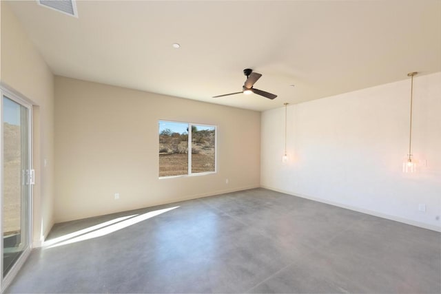 unfurnished room with concrete floors and ceiling fan