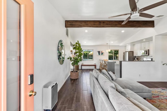 living room featuring ceiling fan, vaulted ceiling with beams, and dark hardwood / wood-style floors