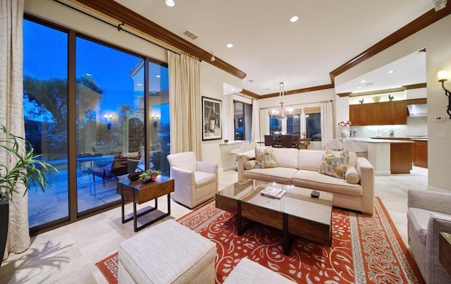 living room with a notable chandelier and ornamental molding