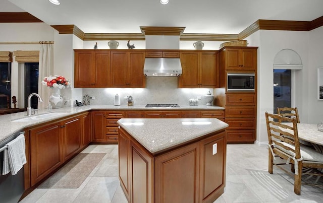 kitchen with backsplash, light stone counters, sink, black appliances, and range hood