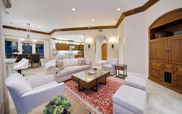 living room with ornamental molding and a chandelier