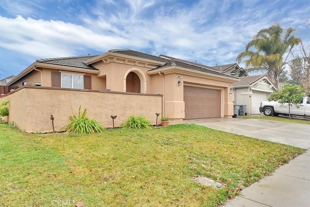 view of front of property with a front lawn and a garage