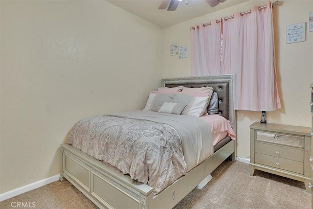 bedroom with ceiling fan and light colored carpet