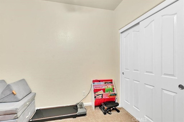 workout room featuring carpet floors