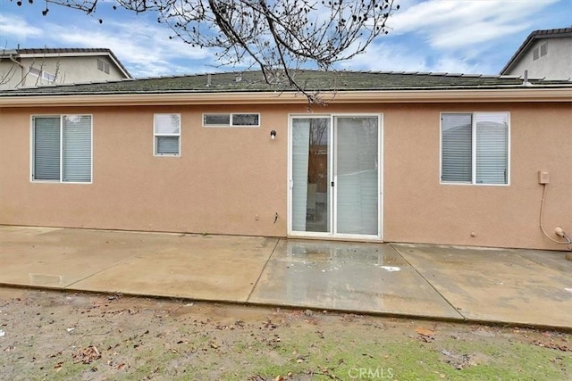 rear view of house with a patio