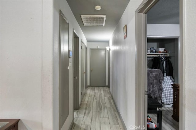 hallway featuring light wood-type flooring