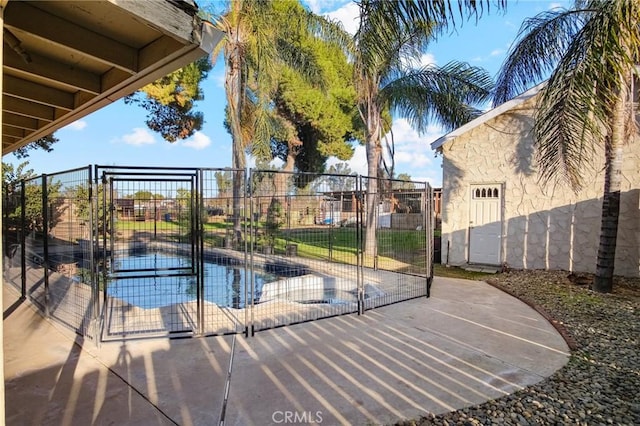 view of swimming pool featuring a patio