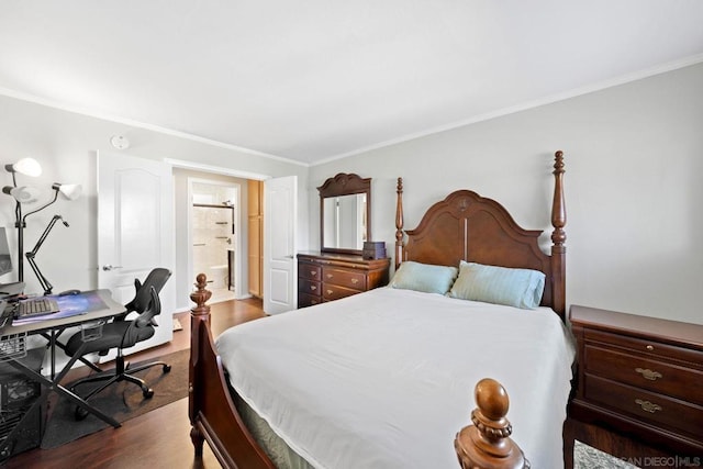 bedroom featuring ornamental molding, dark hardwood / wood-style floors, and ensuite bathroom