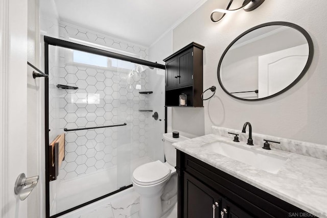 bathroom featuring vanity, toilet, crown molding, and walk in shower