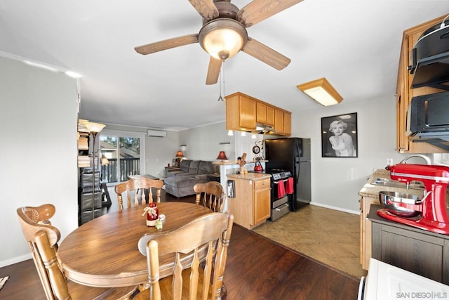 dining space with dark wood-type flooring, ceiling fan, and a wall mounted AC