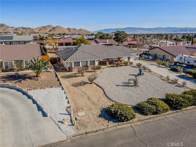 birds eye view of property featuring a mountain view