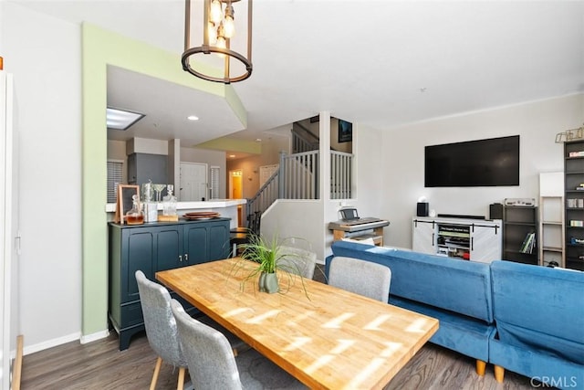 dining area featuring dark hardwood / wood-style floors