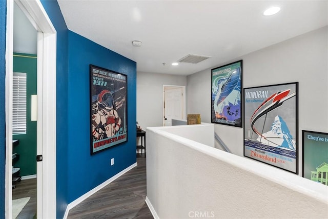 hallway with dark hardwood / wood-style floors