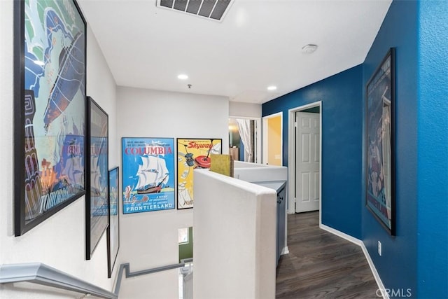 corridor with dark hardwood / wood-style flooring