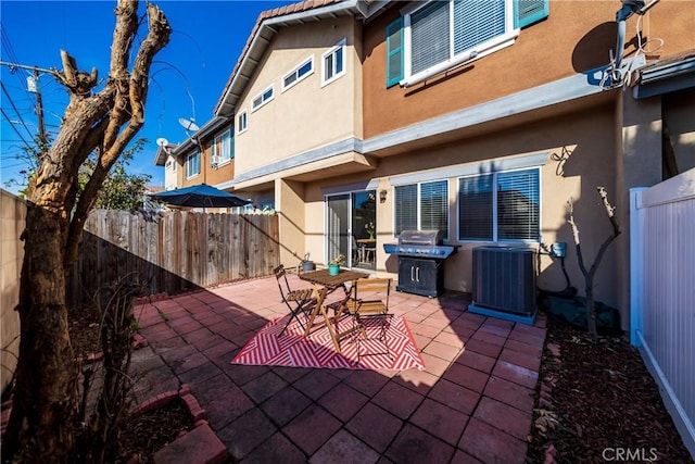 view of patio with central air condition unit and area for grilling