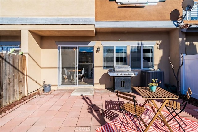 view of patio with a grill