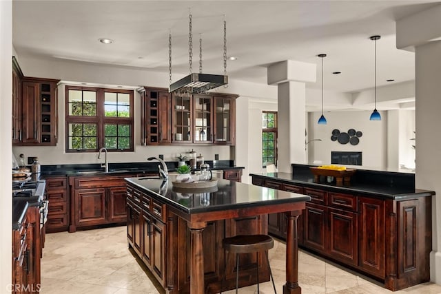 3252 Canyon Oaks, Chico, CA 95928 - kitchen with a wealth of natural light, sink, pendant lighting, and an island with sink