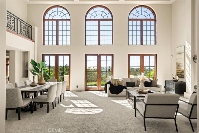 3252 Canyon Oaks, Chico, CA 95928 - living room with a high ceiling, light carpet, and french doors