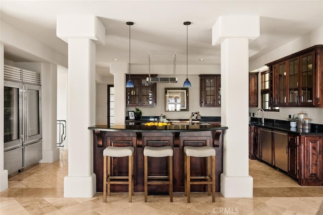 3252 Canyon Oaks, Chico, CA 95928 - bar featuring dark brown cabinetry, sink, and pendant lighting