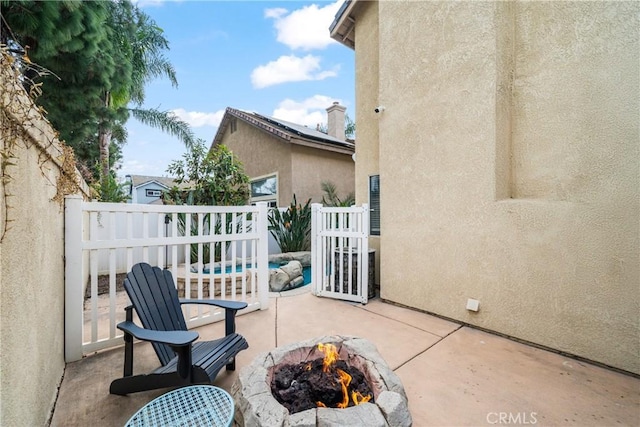 view of patio / terrace with a fire pit