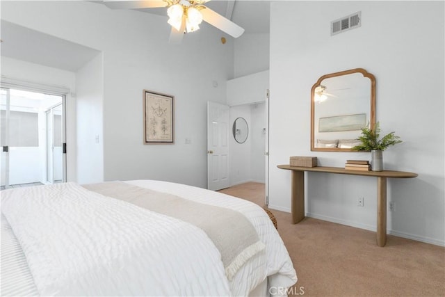 carpeted bedroom featuring high vaulted ceiling and ceiling fan