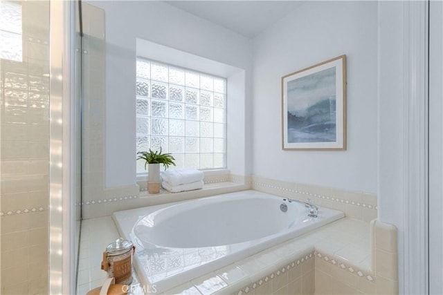 bathroom featuring a relaxing tiled tub