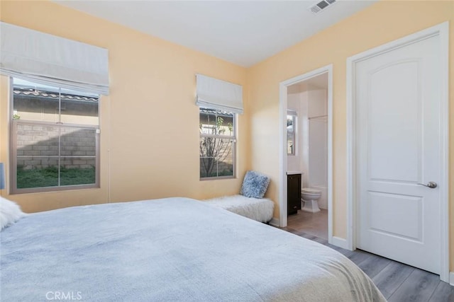 bedroom featuring ensuite bath